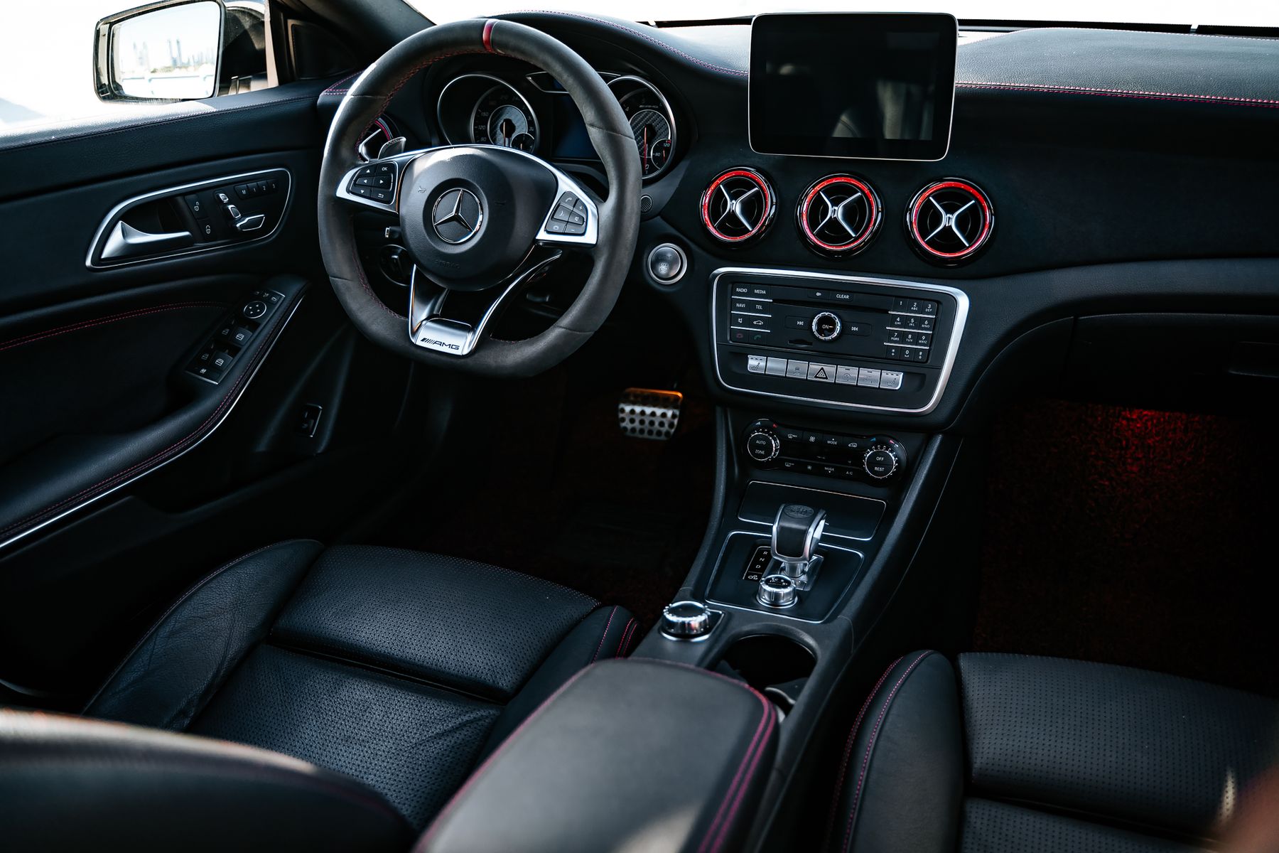 Clean black vehicle seats and center console